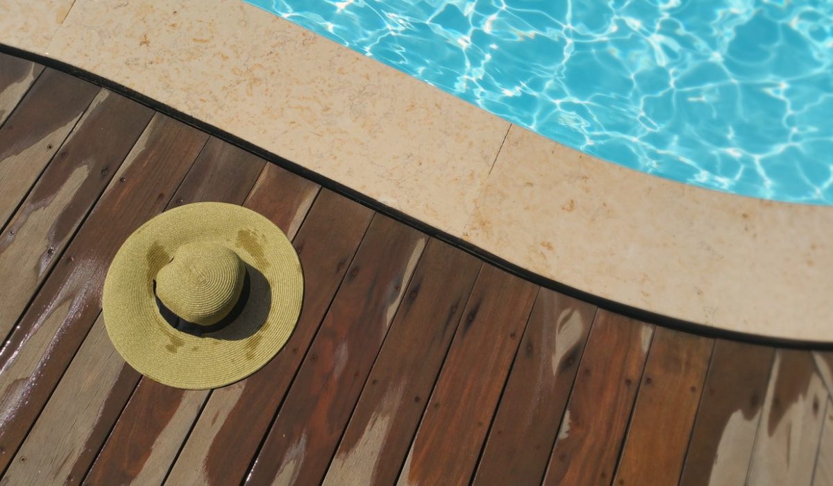 a hat beside the pool a hat beside the pool