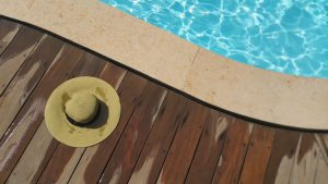 a hat beside the pool