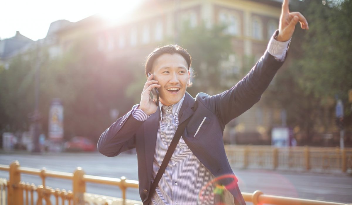 Man hailing a car A man talking to his Uber or Lyft driver
