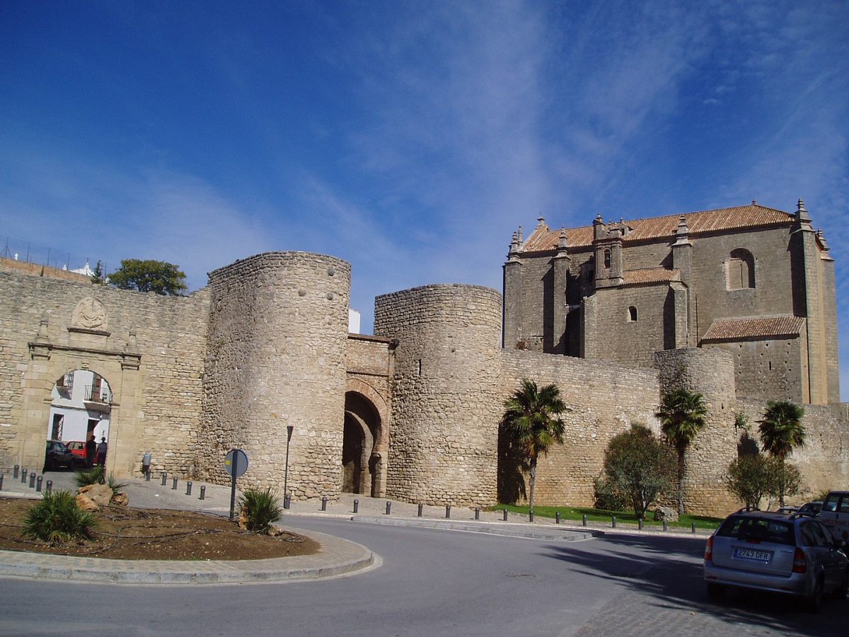 a church behind a castle fortress