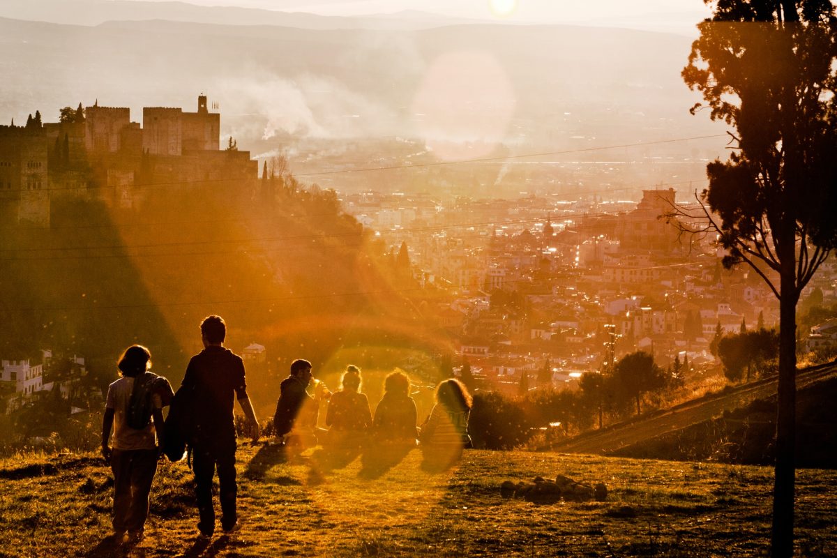 people watching granada's sunset