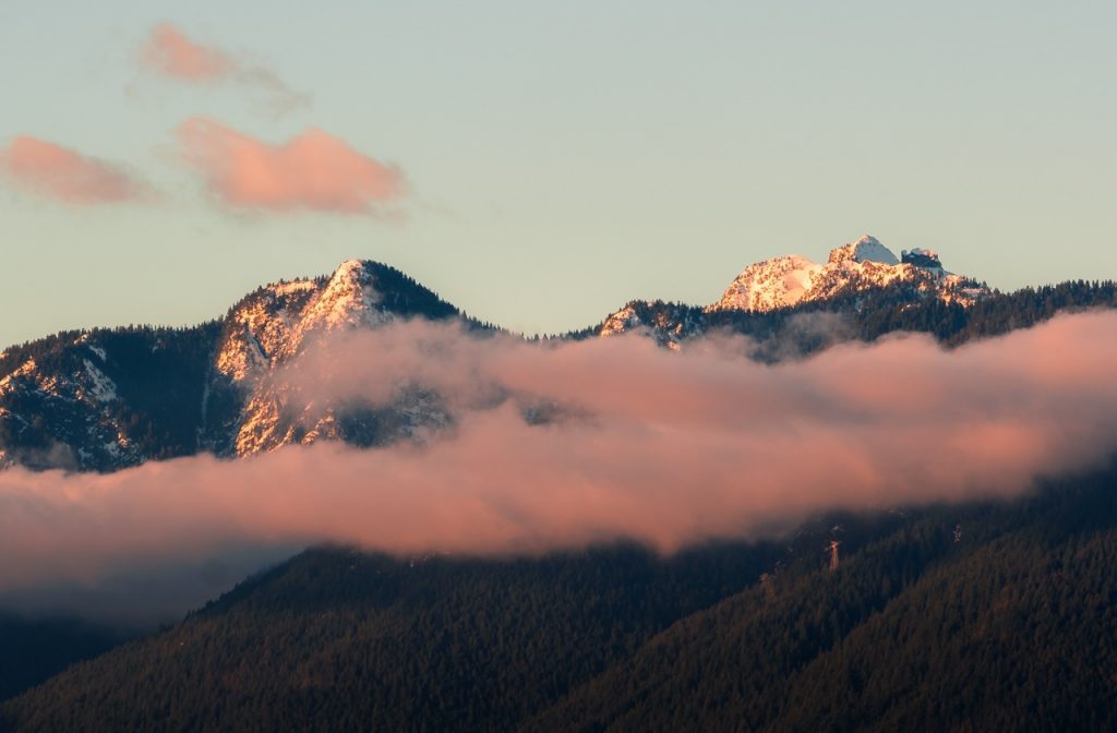 Snow-capped mountain range in sunset