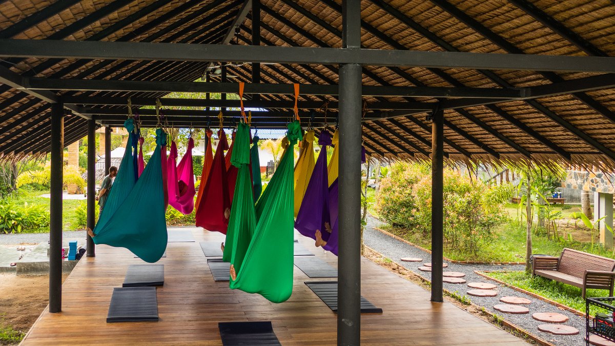 colorful cloth hammocks used for yoga