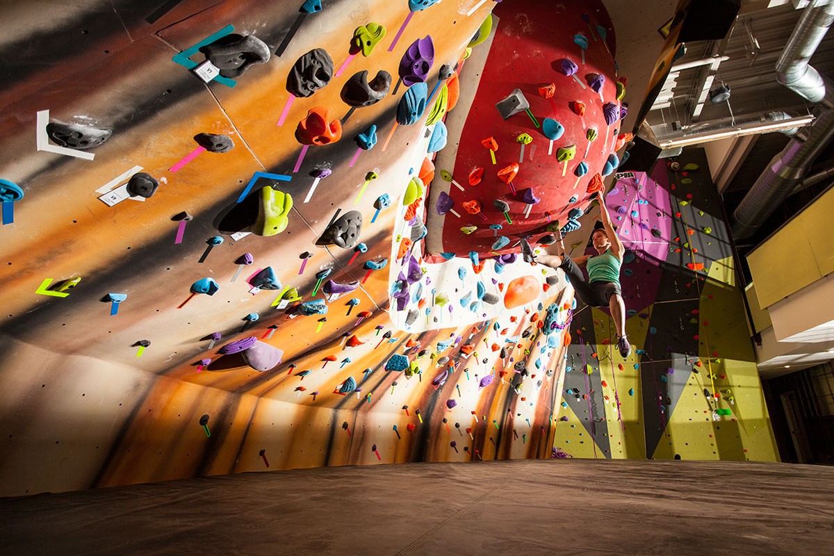 an indoor bouldering gym with an eye-designed wall an indoor bouldering gym with an eye-designed wall