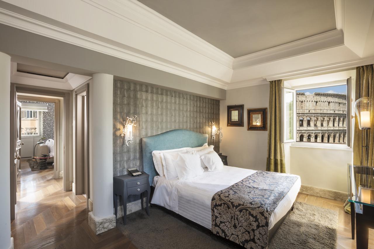 a hotel room with a view of the colosseum a hotel room with a view of the colosseum