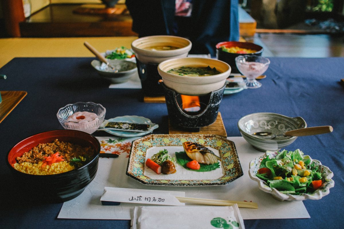 different japanese dishes on a blue table