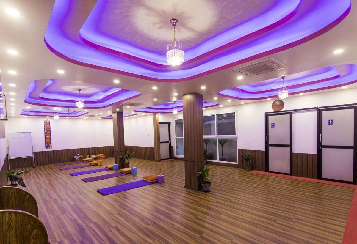 a yoga studio with purple lights