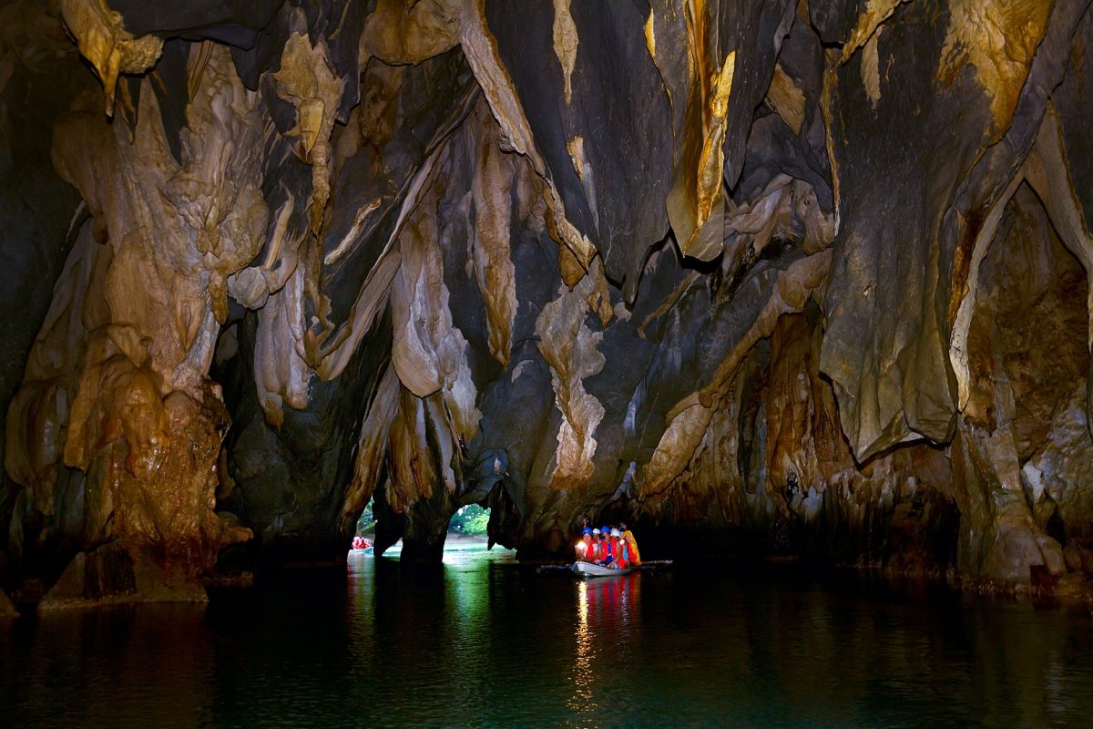 a group of people caving in Palawan