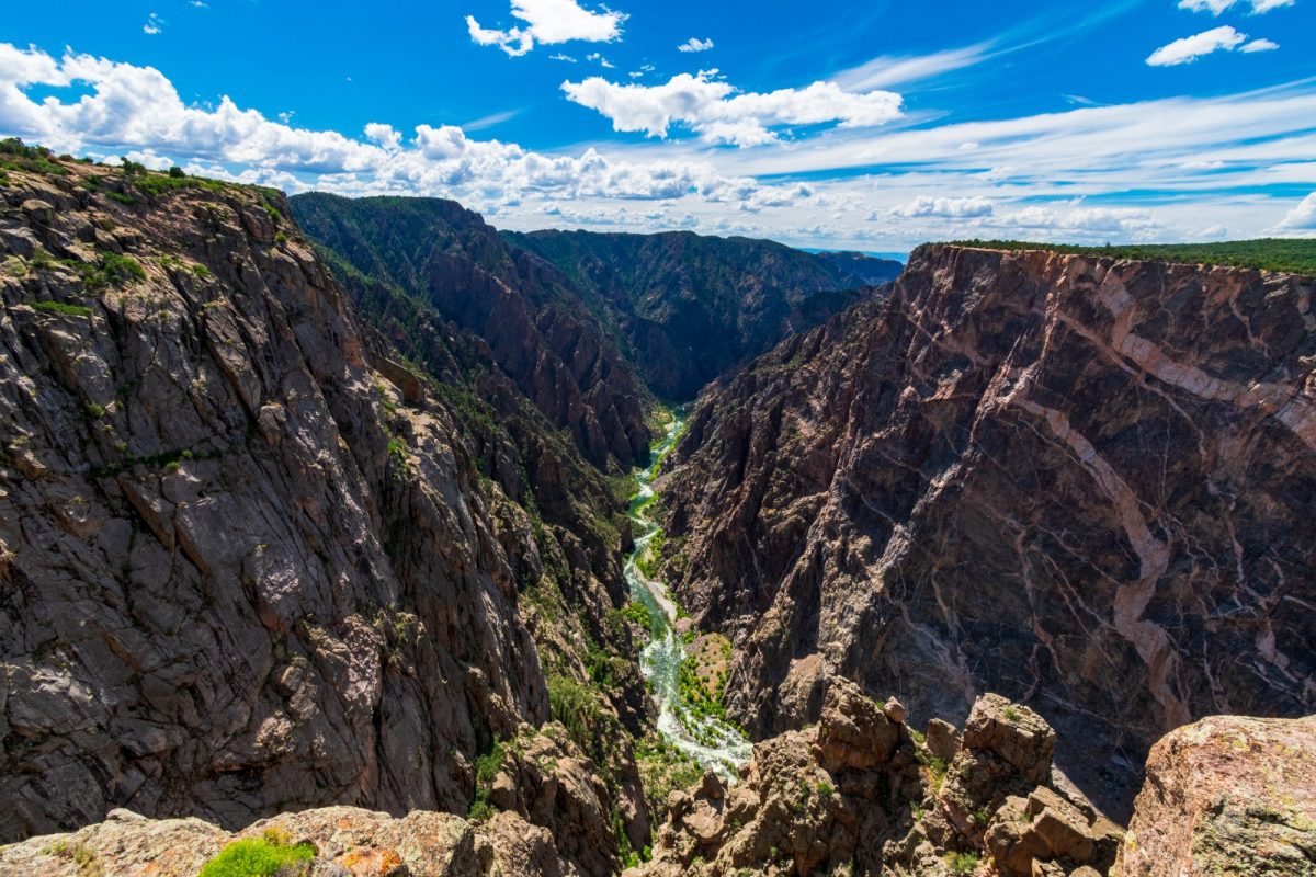 a narrow river between large canyons, car camping