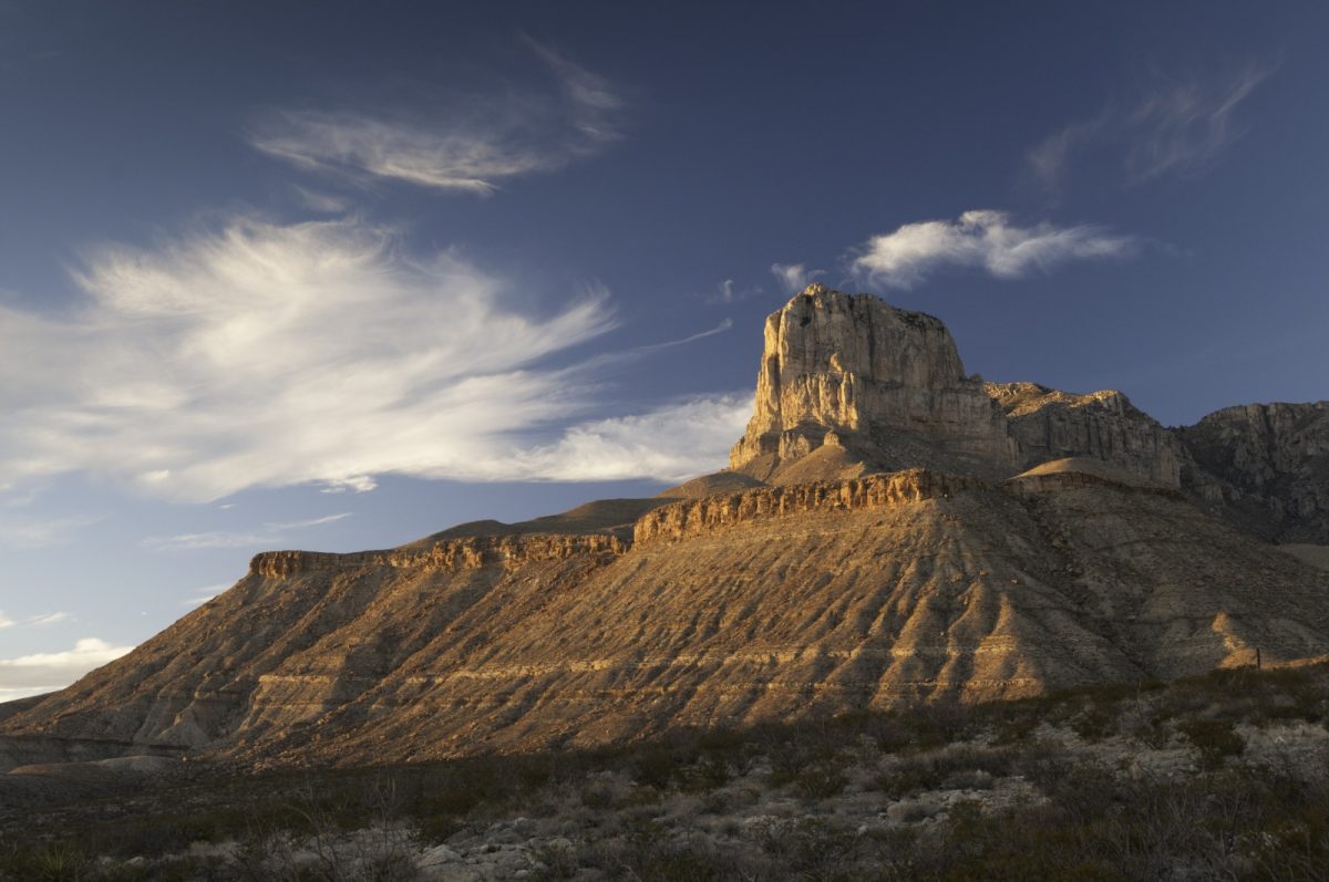 a palatial mountain in the desert, car camping