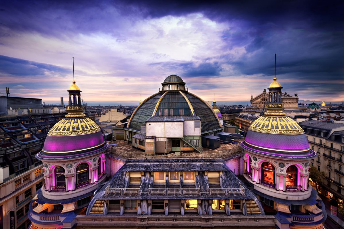 a shopping mall with purple-lit domes a shopping mall with purple-lit domes