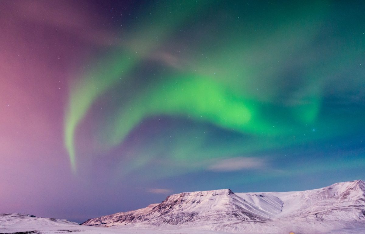 northern lights seen on the mountains in Iceland