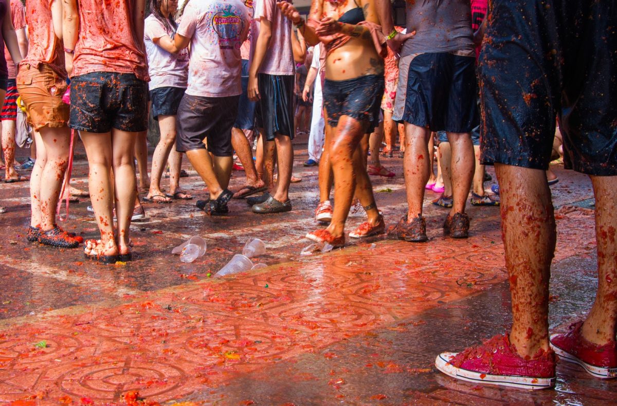 a crowd celebrating the tomato festival in Spain a crowd celebrating the tomato festival in Spain