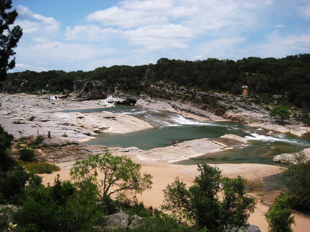 a river with limestone slabs in Pedernales Falls State Park, car camping