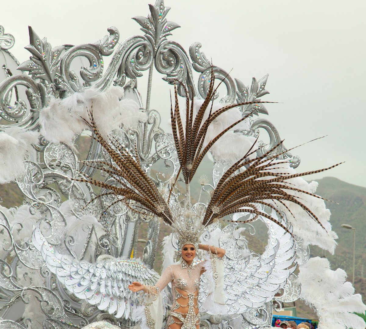A woman parading a gigantic costume