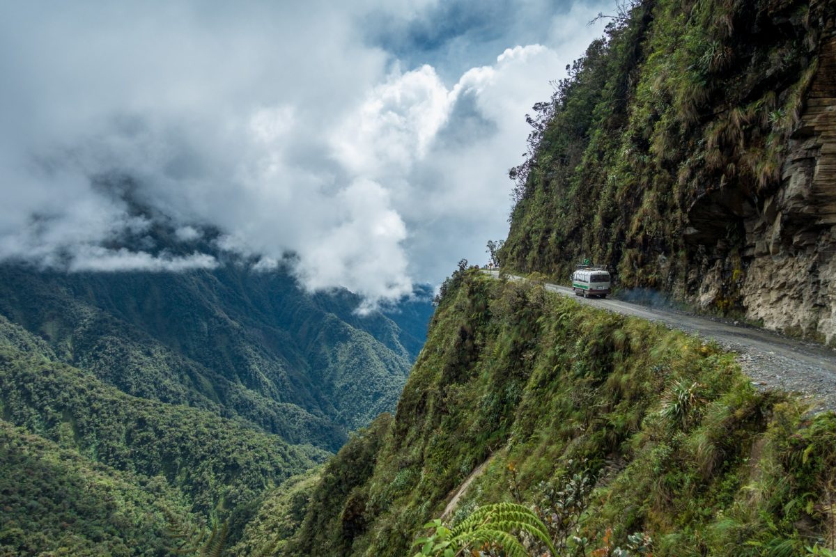 a van traversing the Death Road in Bolivia a van traversing the Death Road in Bolivia
