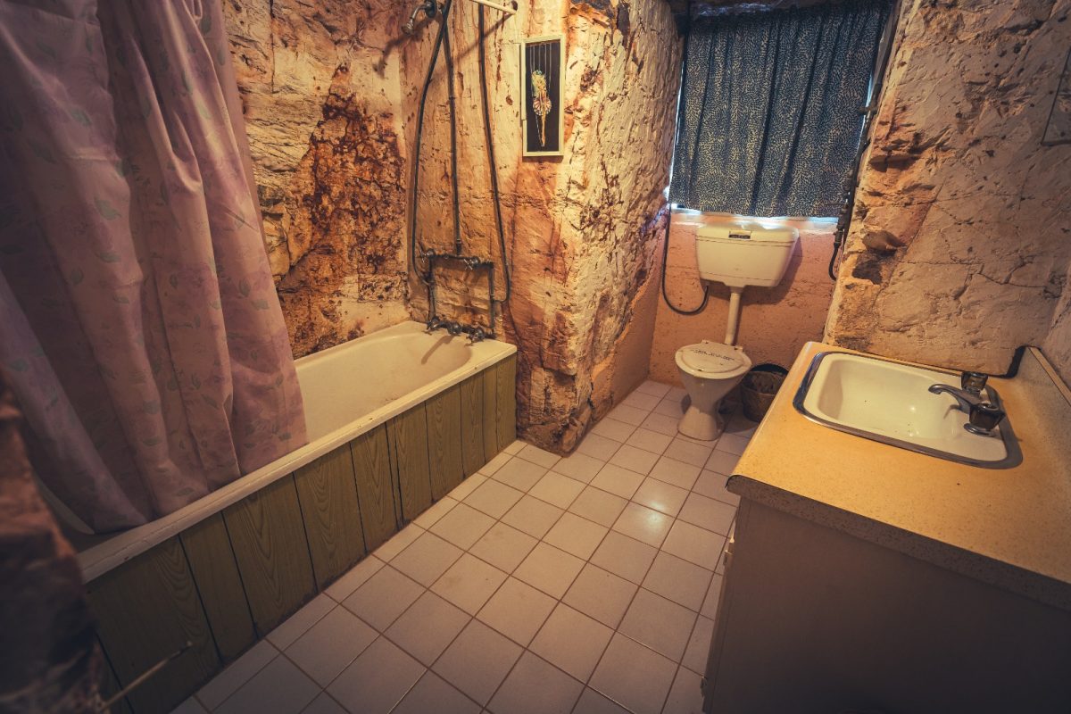 a bathroom in an underground house in coober pedy