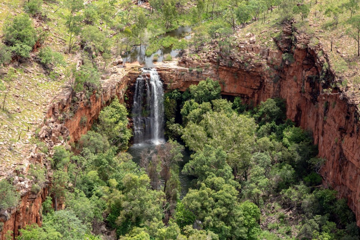 a plunge pool between cragged cliffs