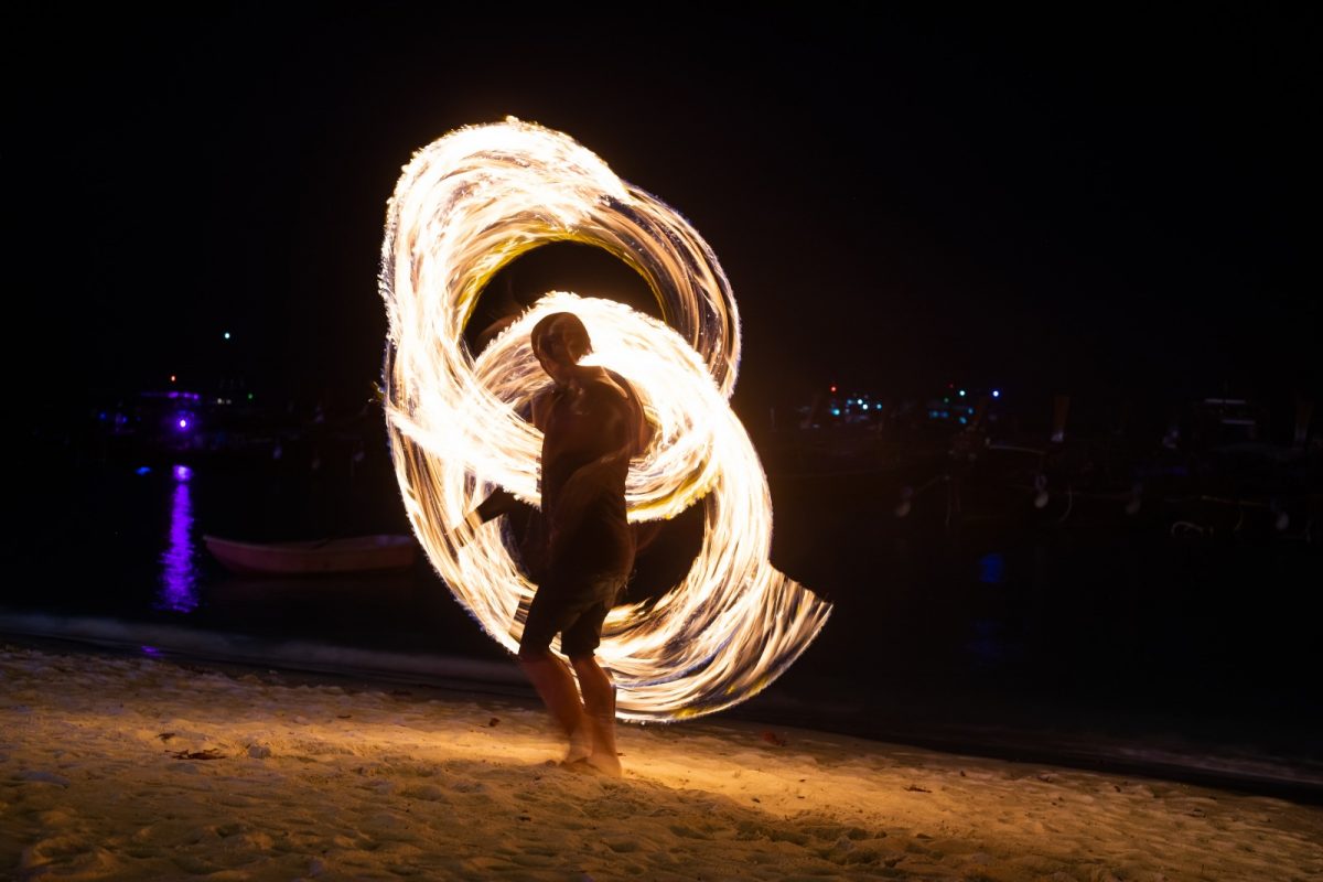 a local fire dancer amusing the crowd