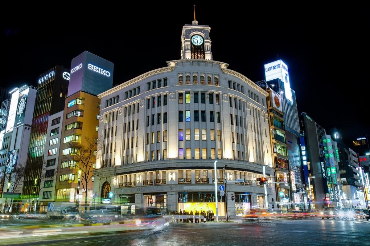 a shopping mall with a clock tower in one tokyo district