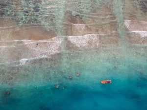 a person kayaking on the clear waters of perhentian islands