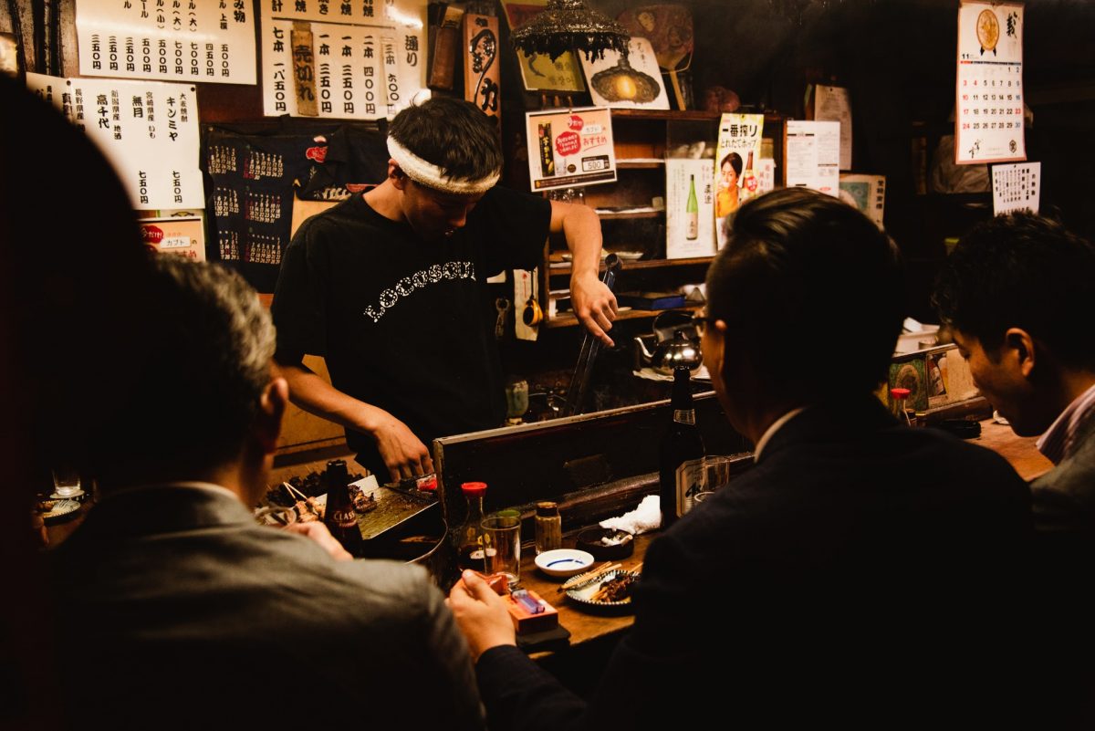 three men dining in the nightlife district of tokyo three men dining in the nightlife district of tokyo