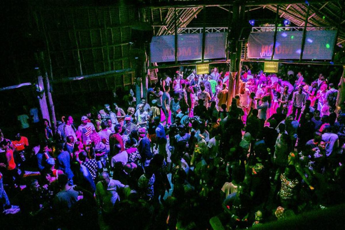 a crowd celebrating full moon party in tanzania a crowd celebrating full moon party in tanzania