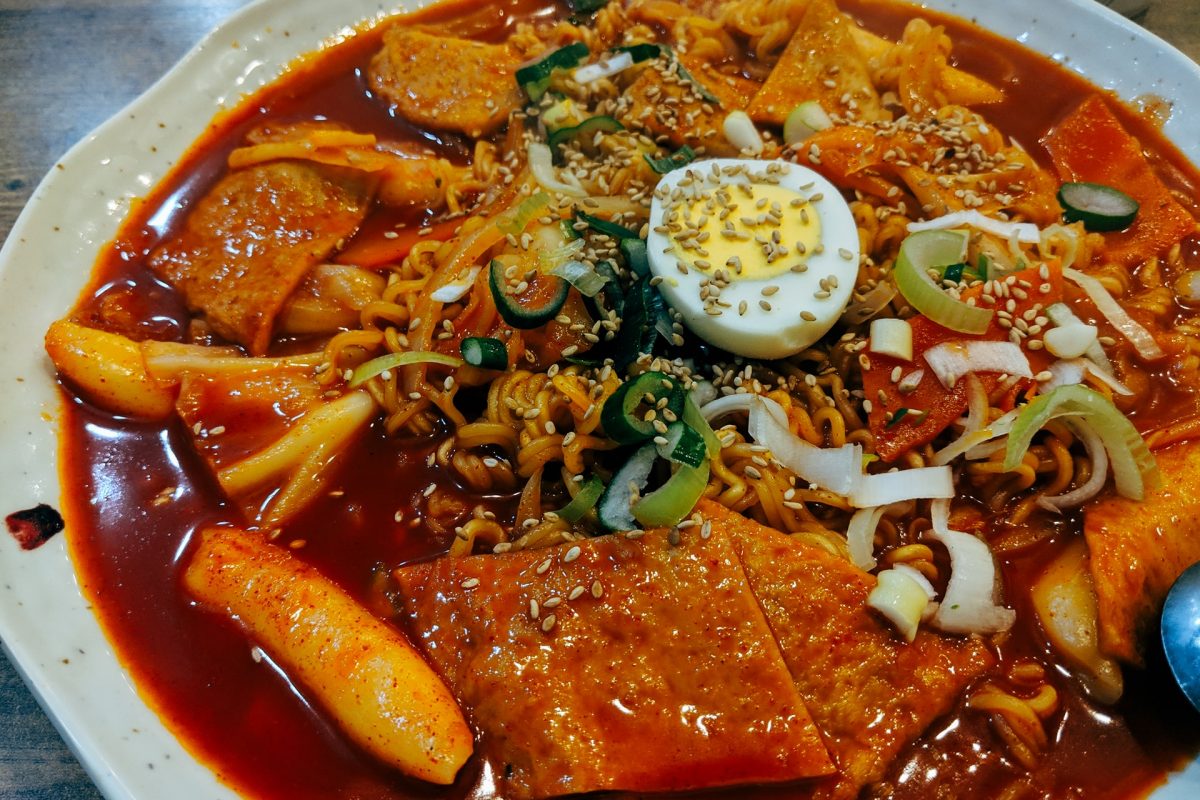 a plate of tteokbokki with fishcake and egg a plate of tteokbokki with fishcake and egg