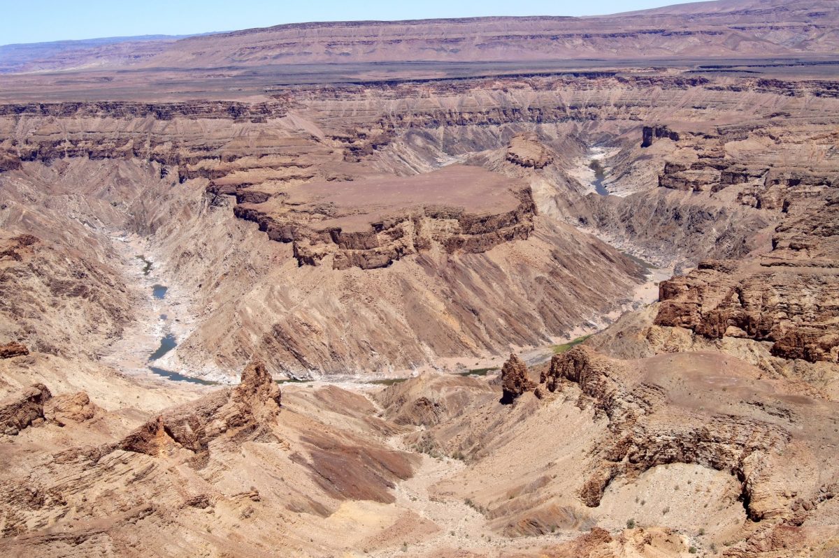 a deep canyon surrounded by rugged cliffs