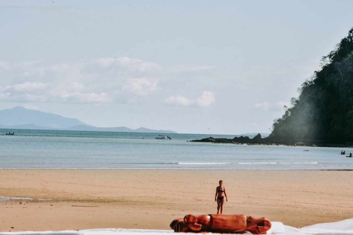 a woman walking in the beach at madagascar