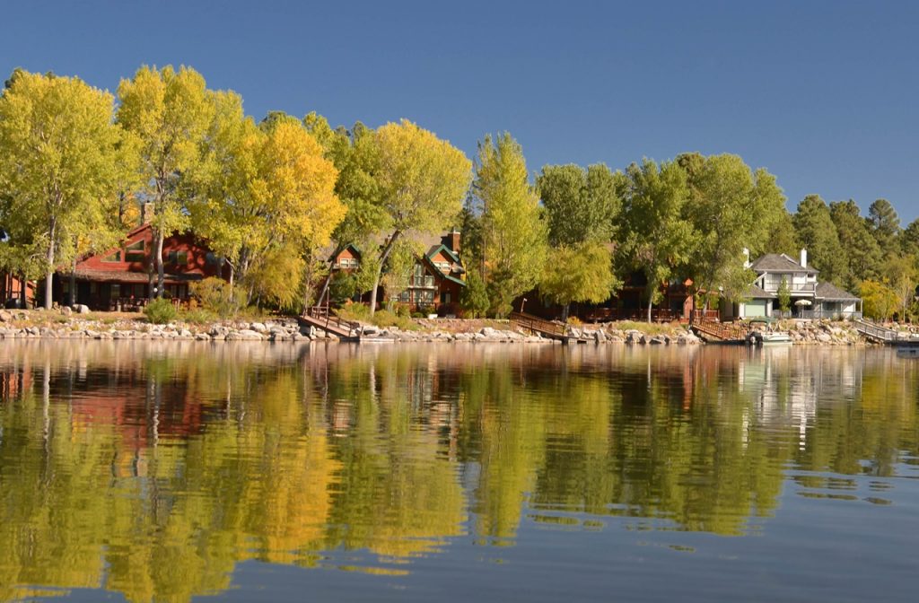 Trees reflected in the water along Rainbow Lake