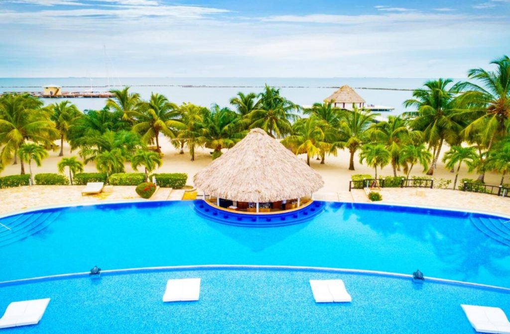Swimming pool and beachfront at The Placencia Resort