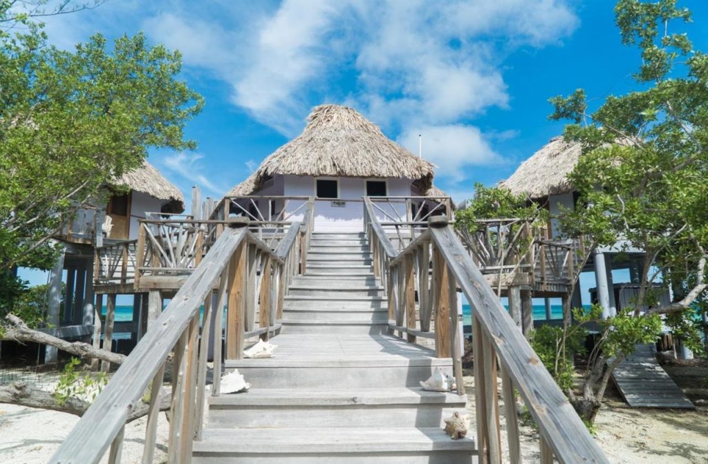 Staircase leading to the cabanas at Thatch Caye Resort