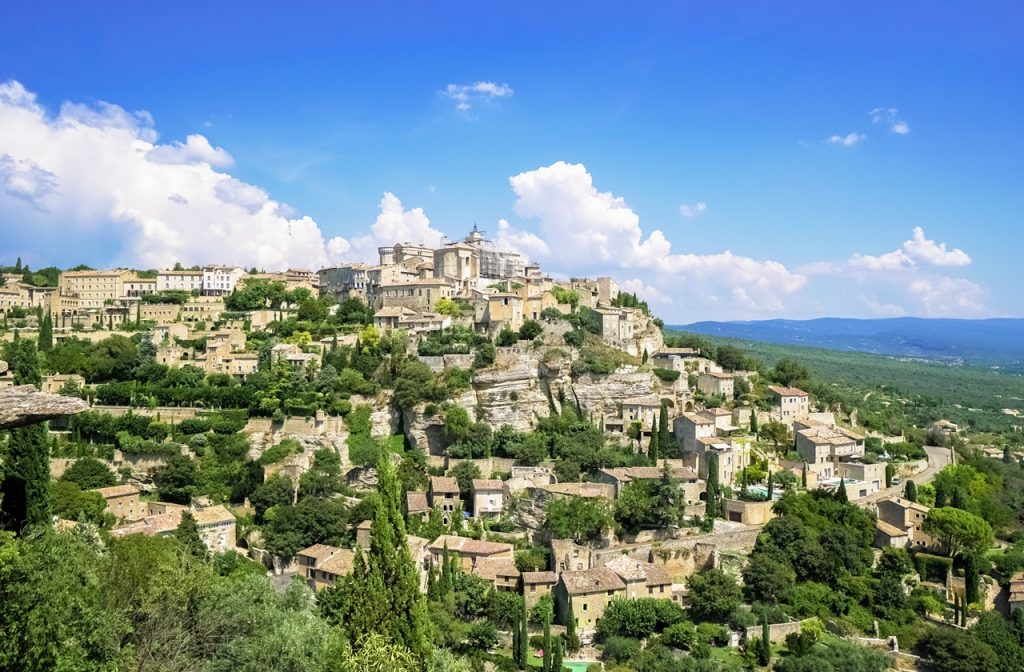 View of Gordes on a cliffside in the French countryside