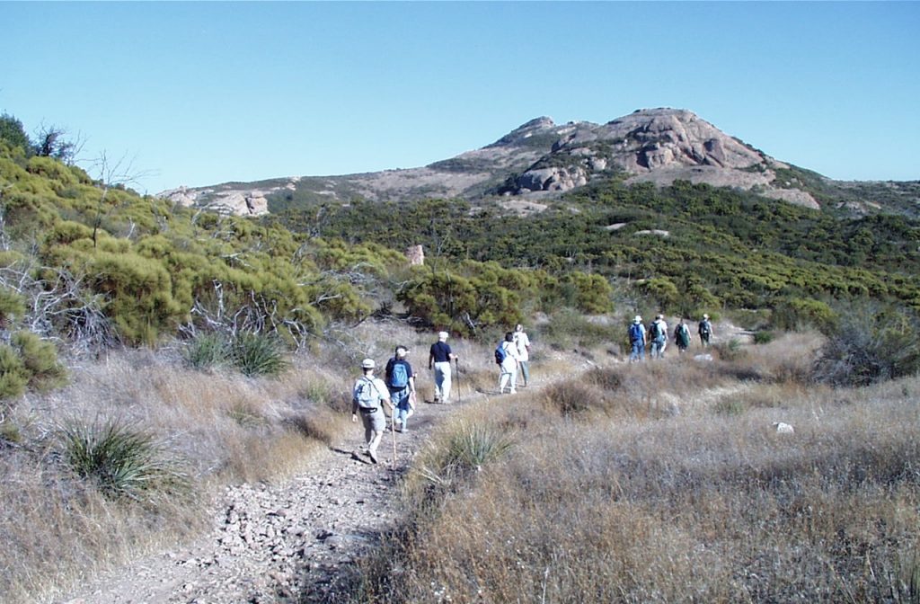 Hikers at Circle X Ranch along Grotto Trail