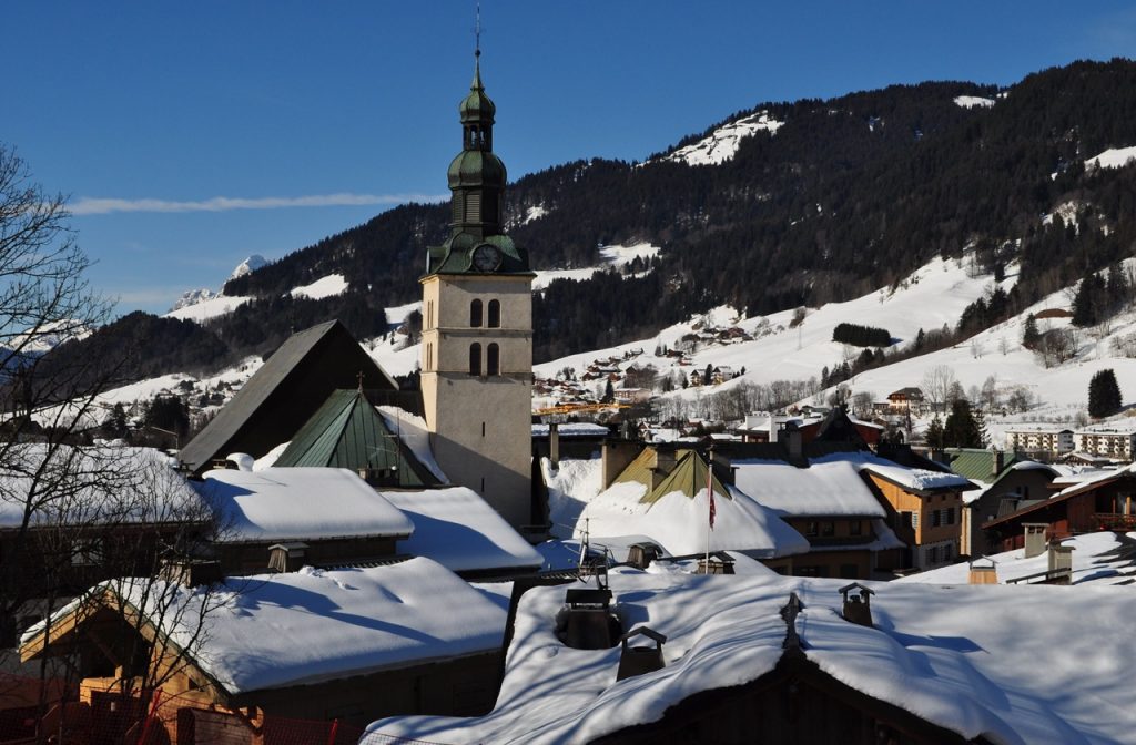 Snow-capped houses and buildings in Megeve during winter