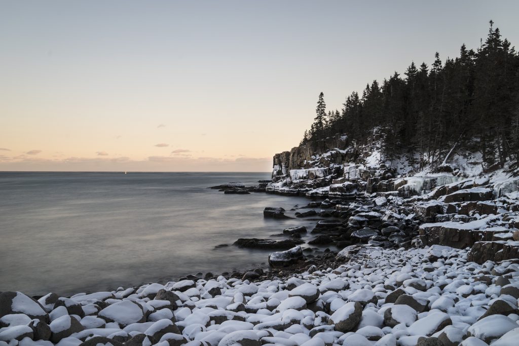 View of the snowy shores of Otter Cliffs in Acadia National Park, Maine