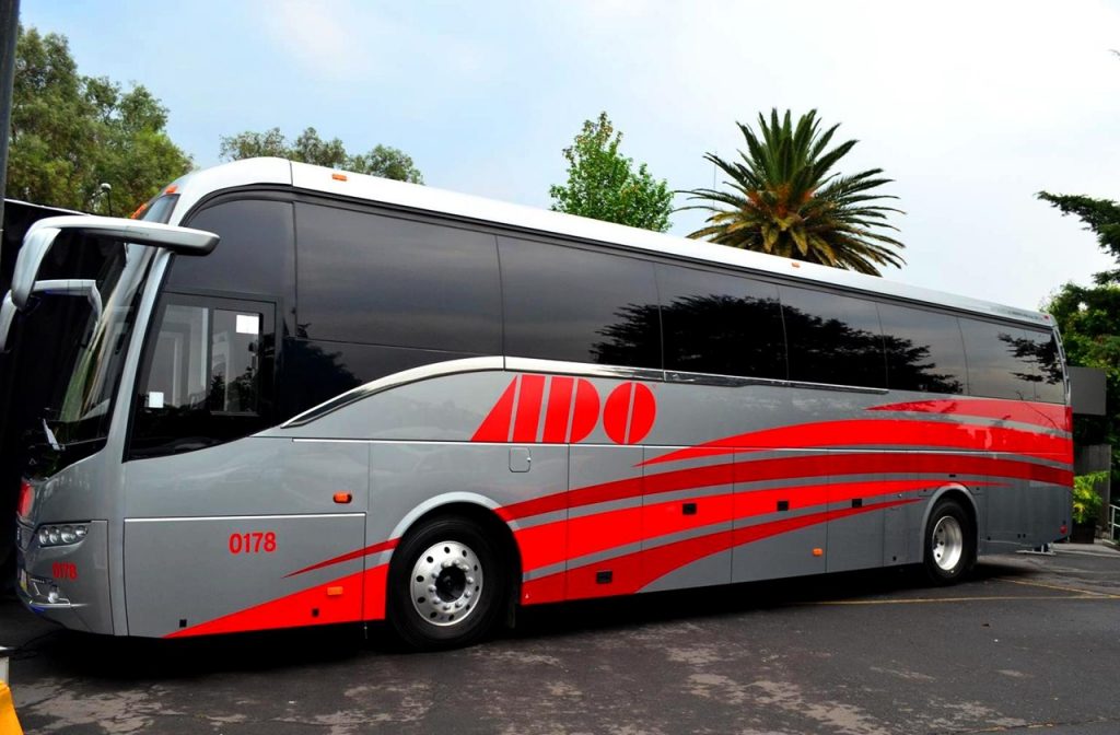 ADO Bus at a parking lot