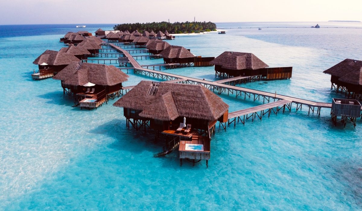 best places to travel during covid Aerial view of villas in the Maldives, one of the best places to travel during COVID