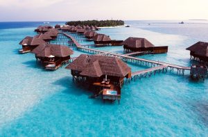 Aerial view of villas in the Maldives, one of the best places to travel during COVID