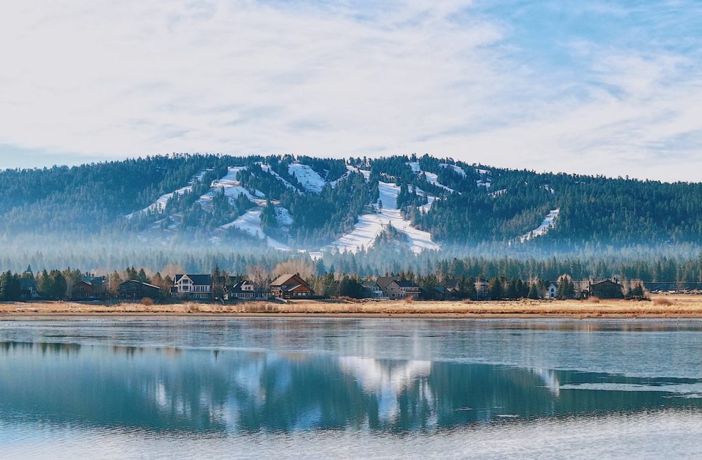 View of Big Bear Lake and the snow-covered ski slopes in the background