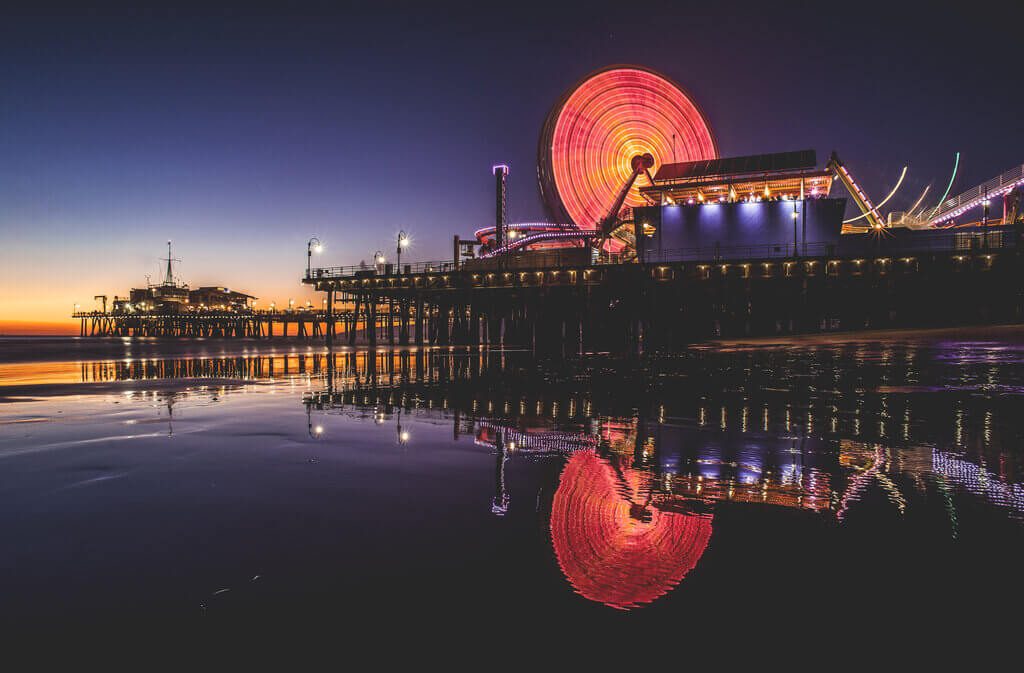 Santa Monica Pier all lit up during dusk