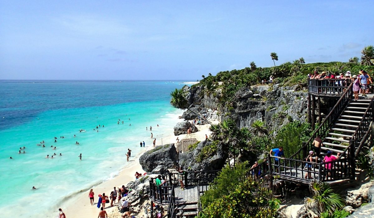 cancun to tulum A tour at the cliffsides in Tulum showcasing its clear beaches, one of the ways on how to get from Cancun to Tulum