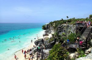 A tour at the cliffsides in Tulum showcasing its clear beaches, one of the ways on how to get from Cancun to Tulum