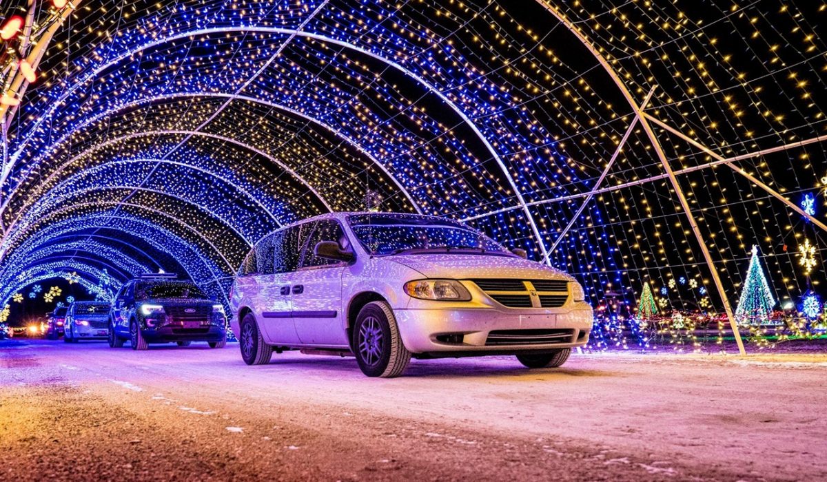 drive thru christmas lights Cars passing through the tunnel at a drive thru Christmas lights show