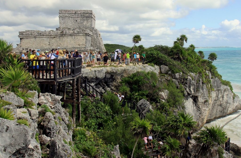 Tourists observing the ruins and beaches in Tulum