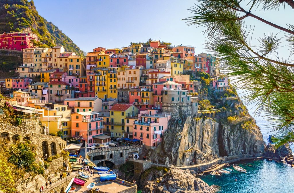 Colorful houses stacked on the cliffside in Manarola