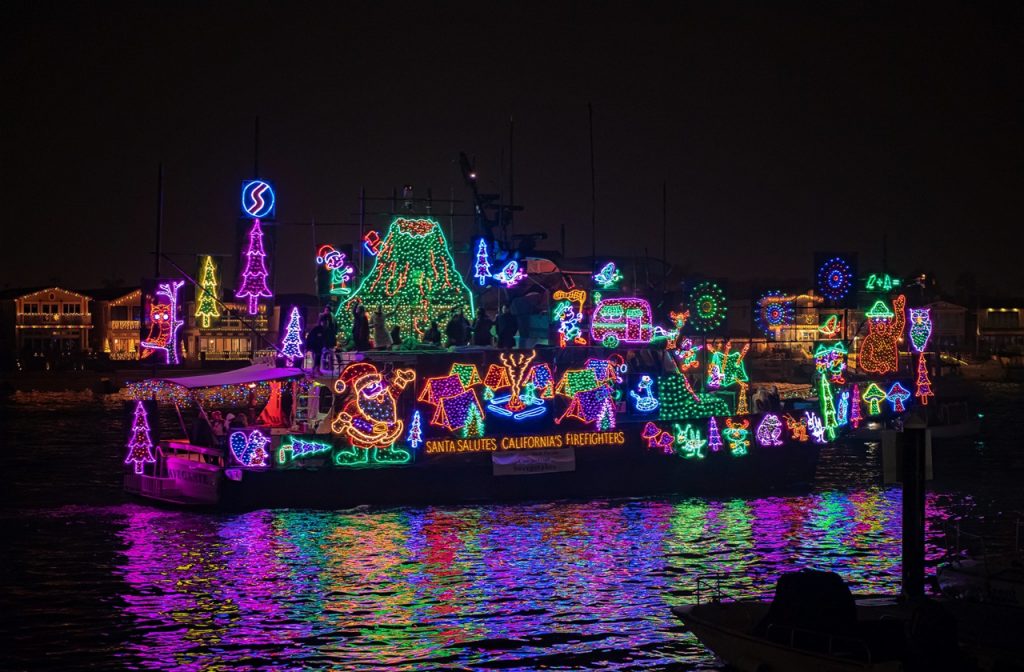 Boat decked with lights at the Newport Boat Parade, one of the best events during Christmas in California