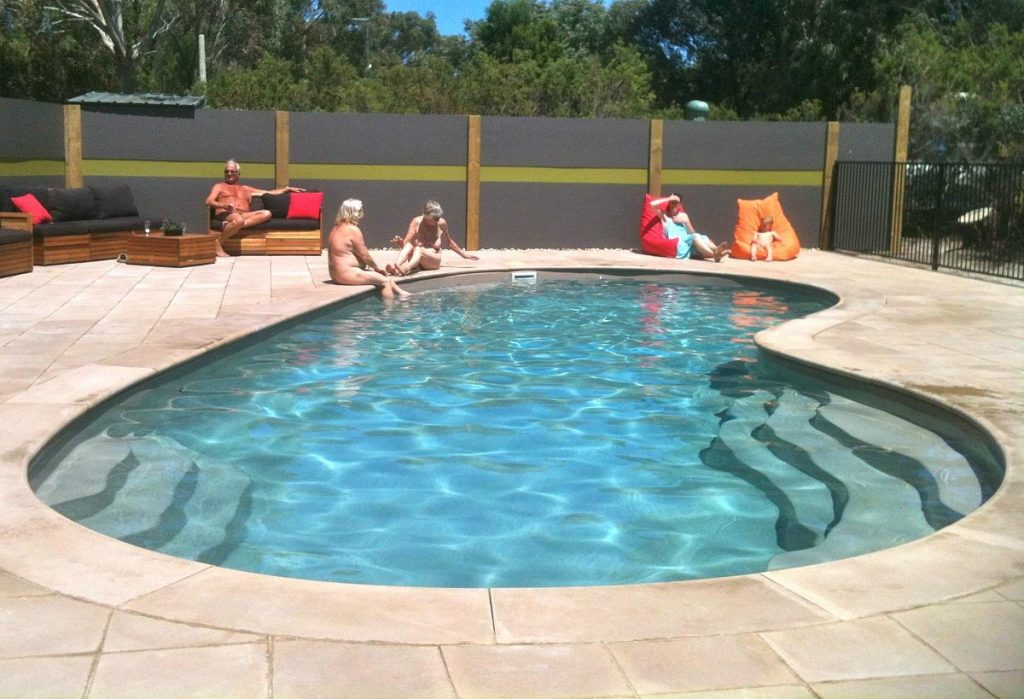 Guests naked and enjoying the pool amenities of Sunland Holiday Village.