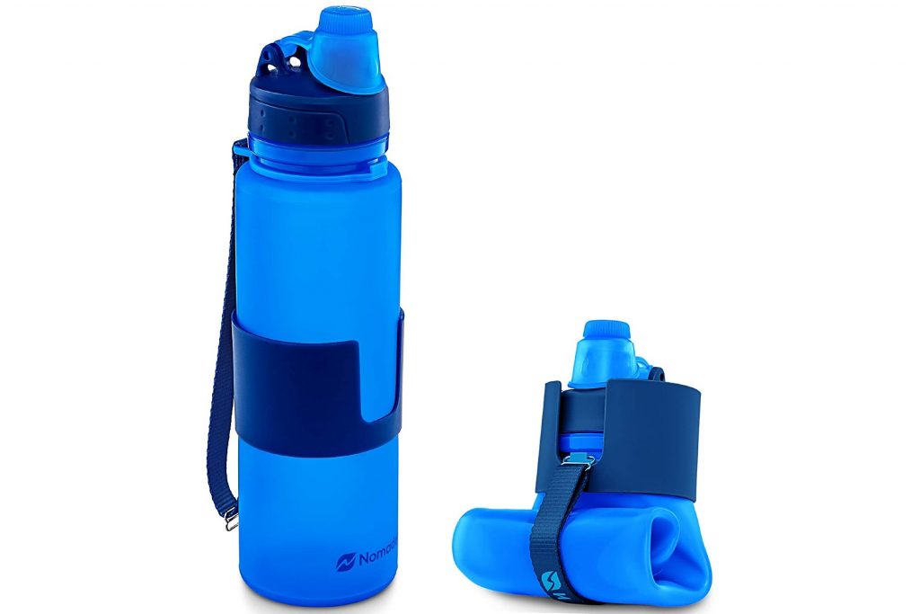 Blue collapsible water bottles from Nomader, one with water and the other empty and folded. 